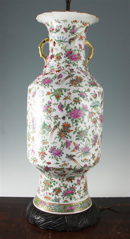A large Chinese Canton-decorated famille rose vase, 19th century, 66cm including wood stand, damage to neck